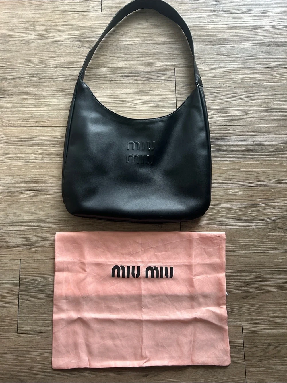 Miu Miu Black Leather Hobo Bag with Embossed Logo